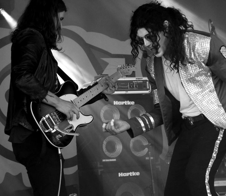David Boakes trading with his guitarist on stage